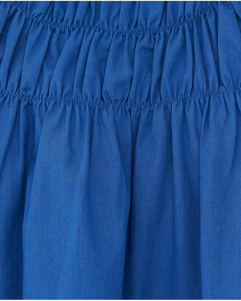 Camicia per bambina blu con fiori e arricciature Tuc tuc